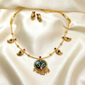 Gold necklace and earrings set on a Enamel Mango Pendant Chain Necklace